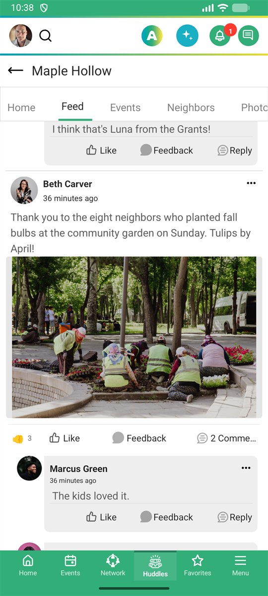 Neighbors planting tulip bulbs in the community garden